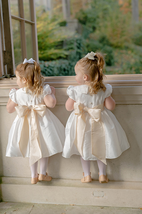 Real wedding: flower girls in traditional white and ivory flower girl dresses by French royal designer Little Eglantine